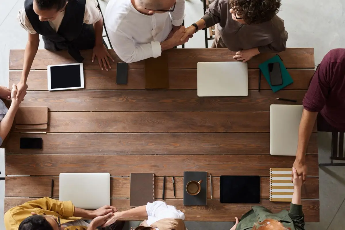 Placeholder image: Members meeting around a table